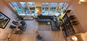 an overhead view of a living room with a couch at The Beautiful Bankmore Penthouse in Belfast