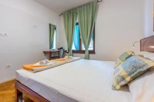 Posteľ alebo postele v izbe v ubytovaní Apartments Opacak Selce