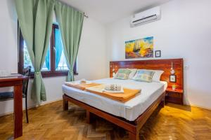 Posteľ alebo postele v izbe v ubytovaní Apartments Opacak Selce