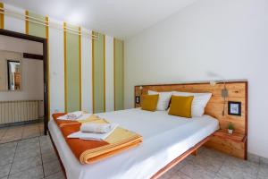 Posteľ alebo postele v izbe v ubytovaní Apartments Opacak Selce