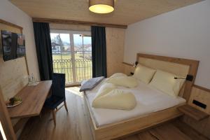 Das Dorfhotel Engl-Grafinger客房内的一张或多张床位