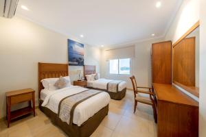 Indium Villas Durrat Al Arus for families only客房内的一张或多张床位