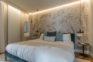 Cama ou camas em um quarto em Madrid 1915 - Luxury Penthouse