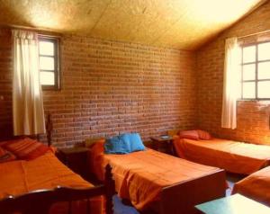 Cama o camas de una habitación en Cabañas Sans Souci