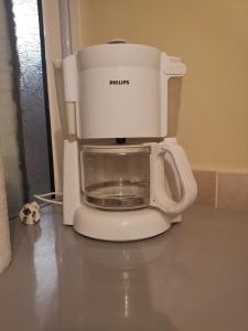 a food processor sitting on top of a counter at Нашето място in Pomorie