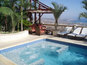 a swimming pool with a view of the city at Sun Set Suite Villa in Peyia