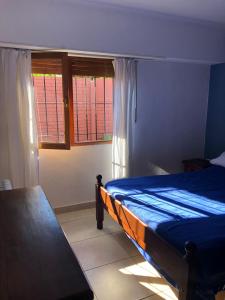 מיטה או מיטות בחדר ב-Casa en Tandil