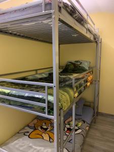 a bunk bed room with three bunk beds in it at Gite Equestre Drôme des Collines in Claveyson