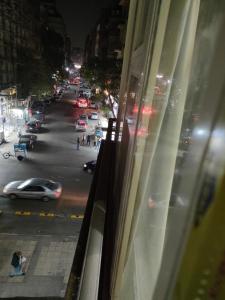 a view from a window of a city street at night at METROPOLITANO in Cairo
