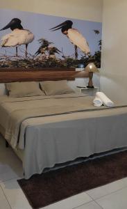 מיטה או מיטות בחדר ב-Pousada Capitão Leno