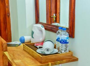 a table with a tea kettle and bottles of water at Onestar Ella in Ella +64 photos