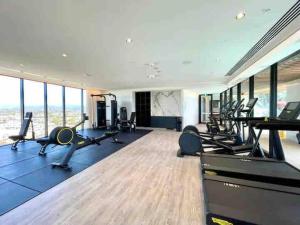 a gym with several treadmills and cardio machines at Casino residence 2-BR ocean view in Gold Coast