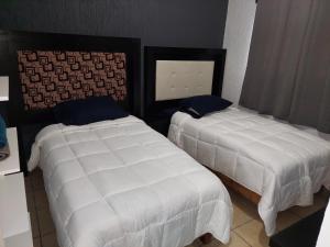 Postel nebo postele na pokoji v ubytování Casa Camichines