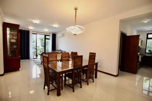a dining room with a table and chairs at Hidden relaxation at Kings residence in Kandy