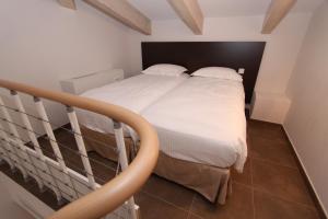 Postel nebo postele na pokoji v ubytování Hôtel A Madonetta