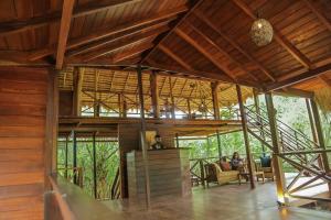 a room with people sitting in chairs in a house at Leopard Nest - Glamping in Yala in Yala