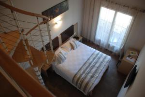 Postel nebo postele na pokoji v ubytování Hôtel A Madonetta