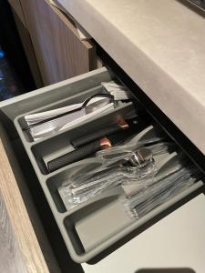 a drawer with utensils in a drawerasteryasteryasteryasteryasteryasteryastery at صممت للاسترخاء in Riyadh