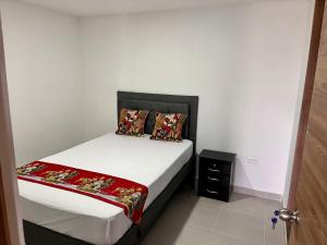 Letto o letti in una camera di Travelu Guatape Apartamento