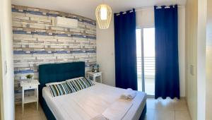 Postel nebo postele na pokoji v ubytování Mythical Sands Resort - Antonios