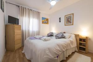 Giường trong phòng chung tại Casa Del Olivo