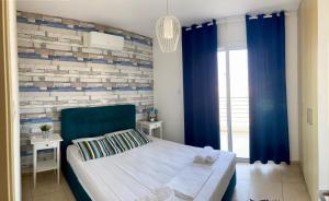 Postel nebo postele na pokoji v ubytování Mythical Sands Resort - Antonios