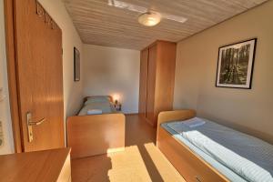 Postel nebo postele na pokoji v ubytování Ersfeld - Bad Teinach Zavelstein