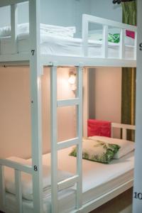 Кровать или кровати в номере DKaYa Hostel