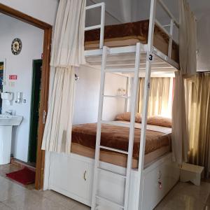 BSH (Bu Sud's House) Yogyakarta客房内的一张或多张床位