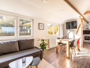 a living room with a couch and a table at Zur Altstadt in Monschau