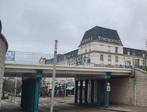 a bridge over a street with a building on it at VITTEL LOC'S - LE 147 - Un Havre de PAIX - CALME in Vittel