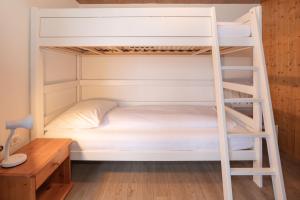 Postel nebo postele na pokoji v ubytování Apartment Jungfrau Lodge