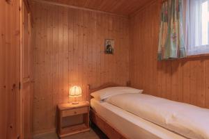 Postel nebo postele na pokoji v ubytování Apartment Jungfrau Lodge