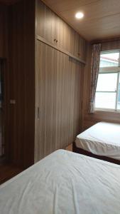 Giường trong phòng chung tại Ming Camphor Homestay