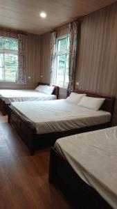 Postel nebo postele na pokoji v ubytování Ming Camphor Homestay + 37 fotografií