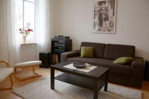 a living room with a couch and a coffee table at Ferien im Winzerhaus in Traben-Trarbach