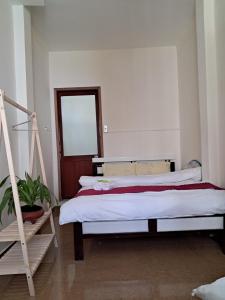 Postel nebo postele na pokoji v ubytování Homestay VICTORY