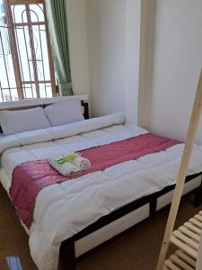 Postel nebo postele na pokoji v ubytování Homestay VICTORY