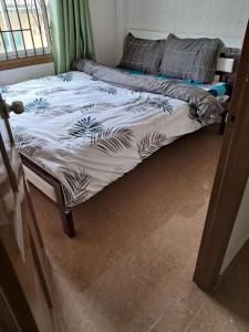 Postel nebo postele na pokoji v ubytování Homestay VICTORY