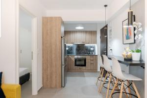 A kitchen or kitchenette at Iosifina Cosy Apartment