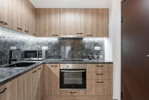 A kitchen or kitchenette at Iosifina Cosy Apartment