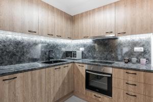 A kitchen or kitchenette at Iosifina Cosy Apartment