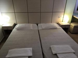 安东尼亚公寓酒店客房内的一张或多张床位