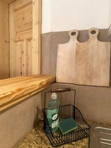 a bottle of detergent sitting on a shelf next to a door at Wohnung in Kirchberg in Tirol in Kirchberg in Tirol