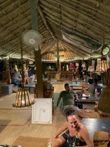a woman sitting on a table in a dance floor at Piccolo Dreams in Canacona
