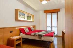 Voodi või voodid majutusasutuse Hotel Biancospino toas