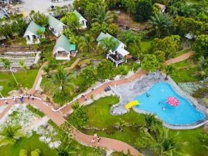 an aerial view of a resort with a swimming pool at KASIH SAYANG Farmstay山下人家 in Kluang