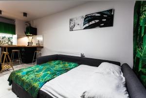 Posteľ alebo postele v izbe v ubytovaní Zielony Apartament Gliwice