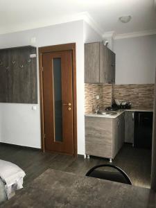 a kitchen with a sink and a counter top at Villa Bakuriani in Bakuriani