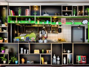 a room with green shelves with plants on them at Greet hotel Darmstadt - an Accor hotel - in Darmstadt